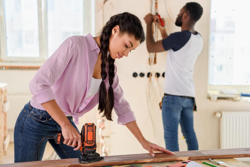 Meticulously organized home renovation workspace with professional power tools and natural lighting.